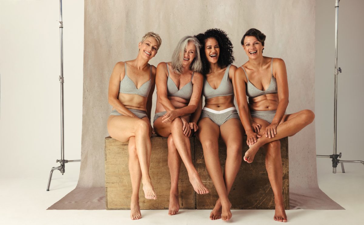 Four,Confident,Women,Of,Different,Ages,Posing,Together,In,Their