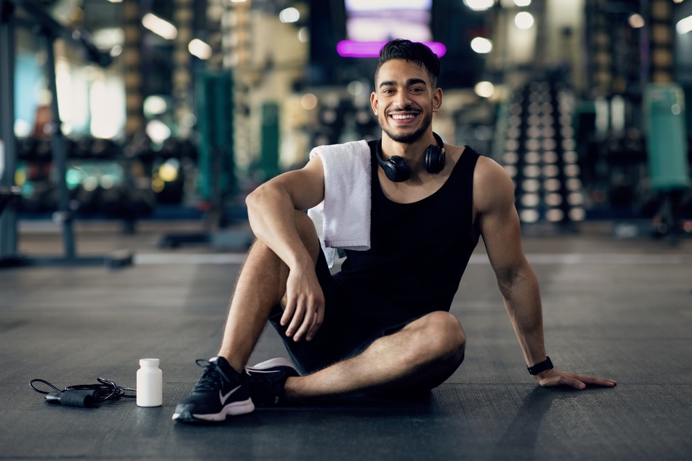 Young,Arab,Male,Athlete,Relaxing,On,Floor,After,Training,At