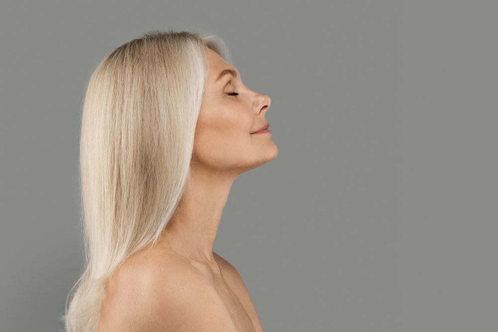 Side,View,Portrait,Of,Beautiful,Mature,Woman,With,Flawless,Skin